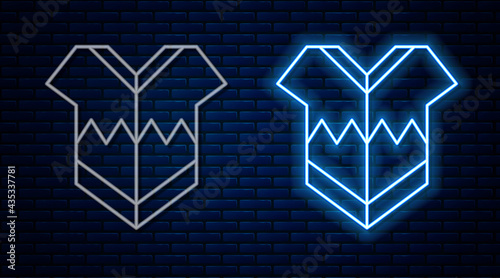 Glowing neon line Traditional mexican poncho clothing icon isolated on brick wall background. Vector