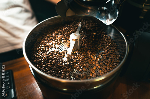 Roasted coffee beans in the machine at a coffee shop