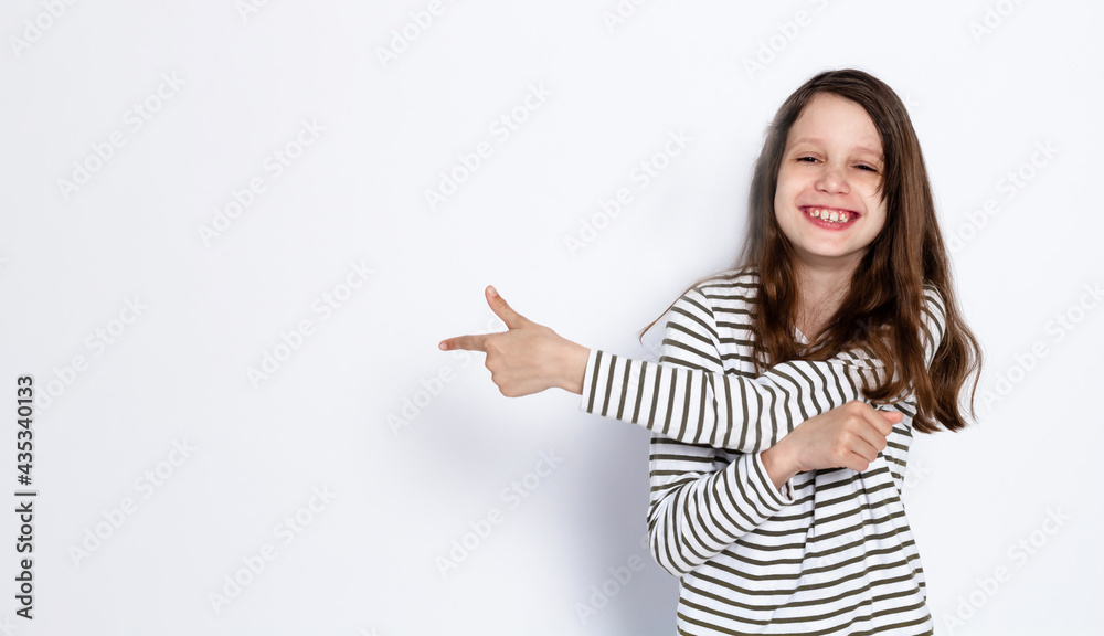 Funny dark-haired girl shows class gesture with her hands. On a light background. Space for text. Funny dark-haired girl shows class gesture with her hands. On a light background. Space for text.