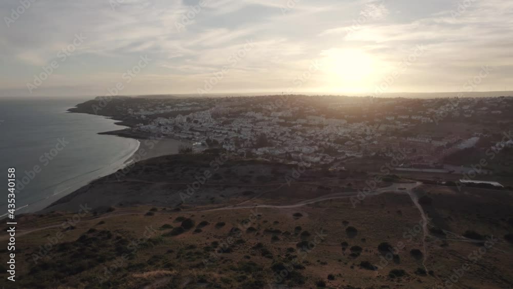 Golden sunset, Algarve Praia da Luz coast from Marco Geodésico da Atalaia. Golden sunset, Algarve Praia da Luz coast from Marco Geodésico da Atalaia.