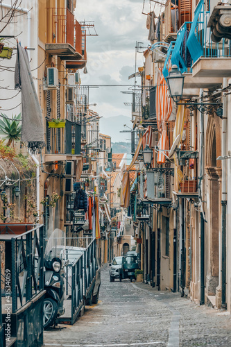 Fototapeta Naklejka Na Ścianę i Meble -  Typical Italian narrow street in old town of Palermo, Italy.