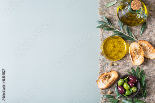 Fototapeta Naklejka Na Ścianę i Meble -  Extra virgin olive oil on a table