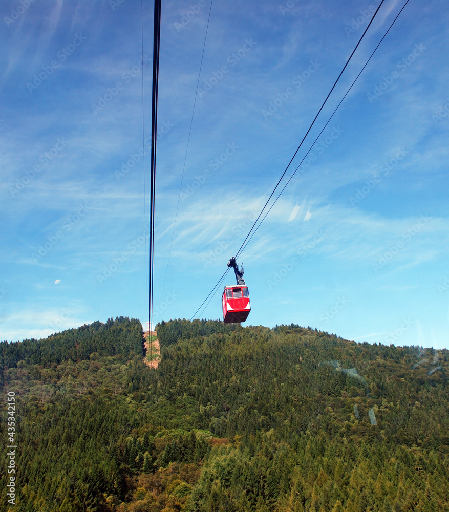 Fototapeta premium Arial Cableway cabin from Stresa to Mottarone mountain. Lake Maggiore, Italy