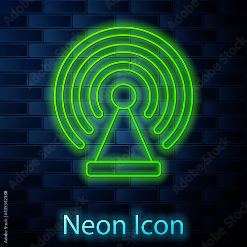Glowing neon line Radar icon isolated on brick wall background. Search system. Satellite sign. Vector