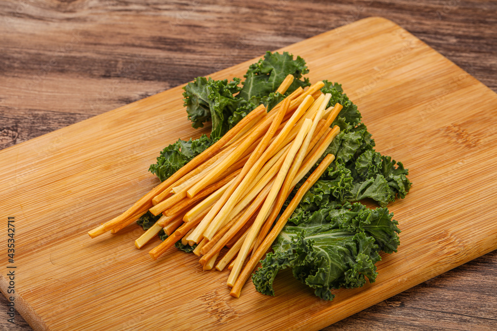 Chechel cheese sticks over board