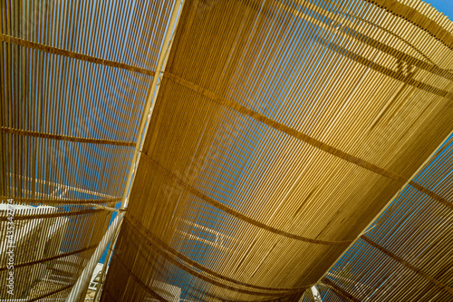 Modern wooden roof at the blue sky background