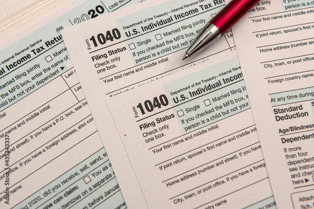 close up of empty us tax form 1040 and ballpoint pen close up of empty us tax form 1040 and ballpoint pen