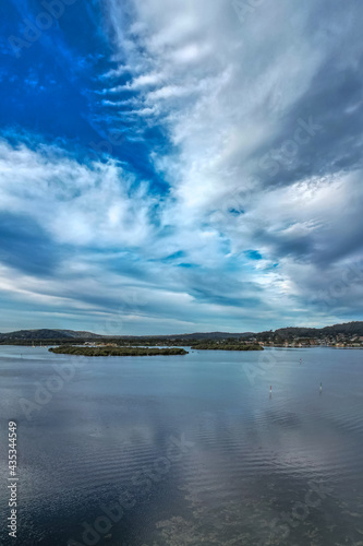 Late afternoon flight over the bay with cloud cover © Merrillie