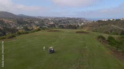AERIAL - Golf course in Zapallar, Valparaiso, Chile, wide forward shot photo
