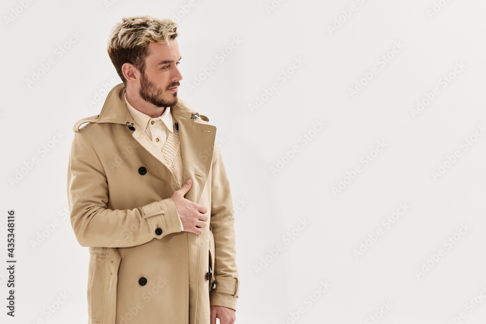 handsome man in a coat fashionable hairstyle autumn style Copy Space handsome man in a coat fashionable hairstyle autumn style Copy Space