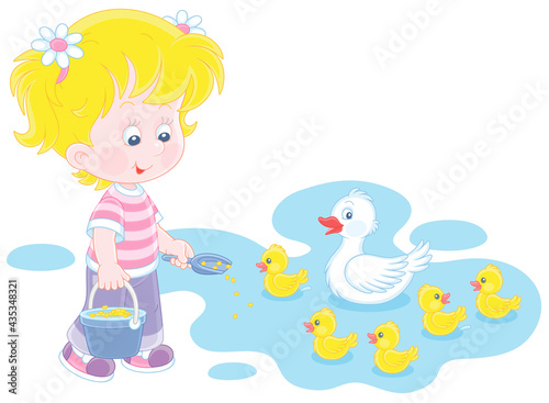 Little girl farmer standing...
