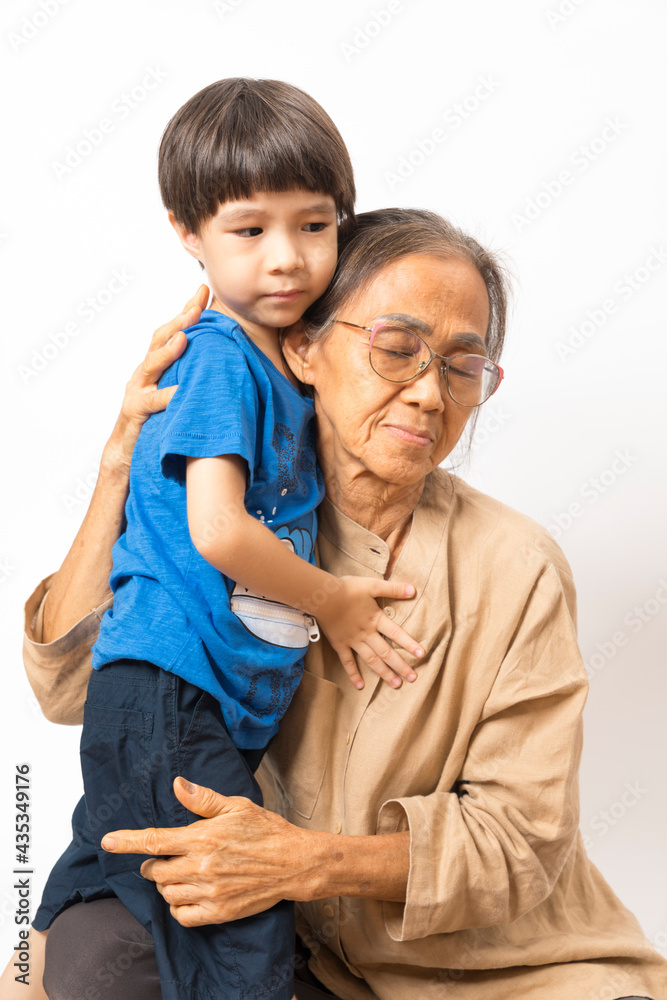 Portrait of happy Asian grandparents and grandson on white background, old senior retired people and child.
