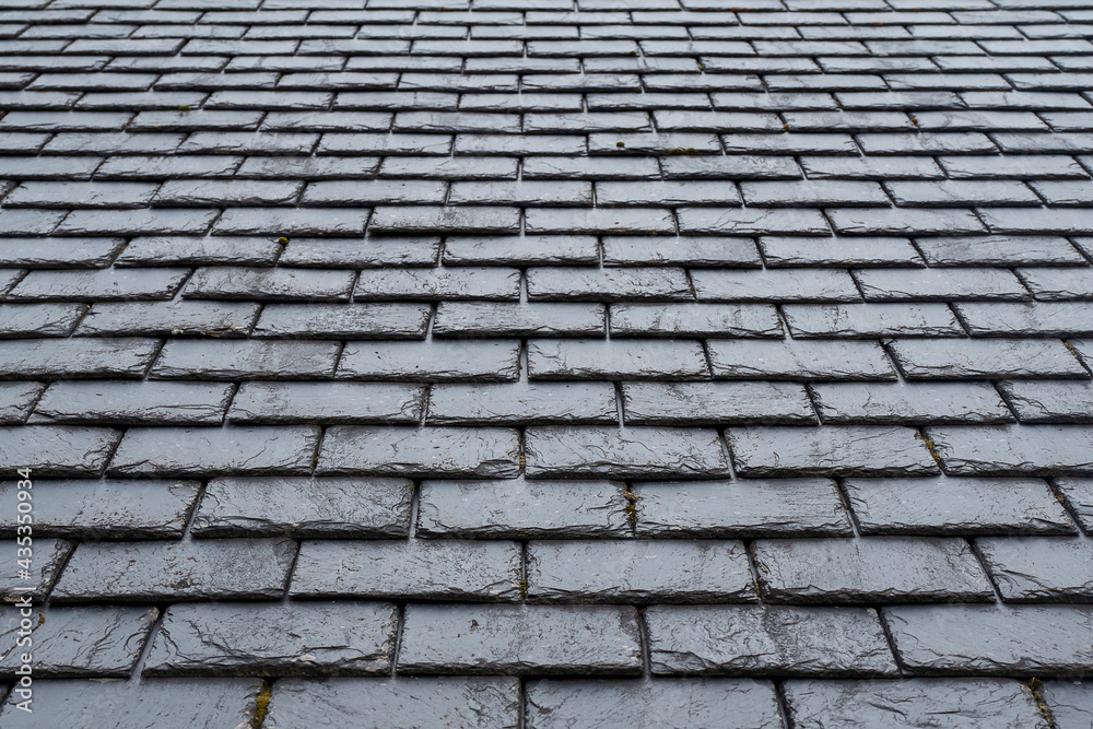 Stone slate tile roof texture. Old style material. Historical building concept