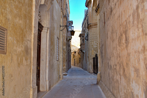 narrow street in old port city © toKLabo