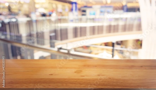 Empty wooden table in front of abstract blurred background of coffee shop . can be used for display Mock up of product