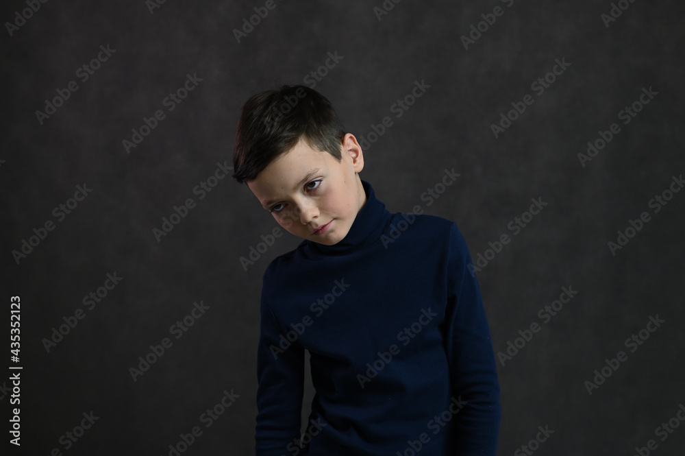 portrait of a serious caucasian guy on a gray background