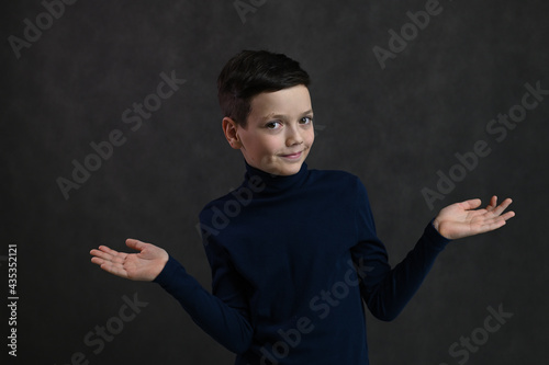 portrait of a cheerful caucasian guy on a gray background