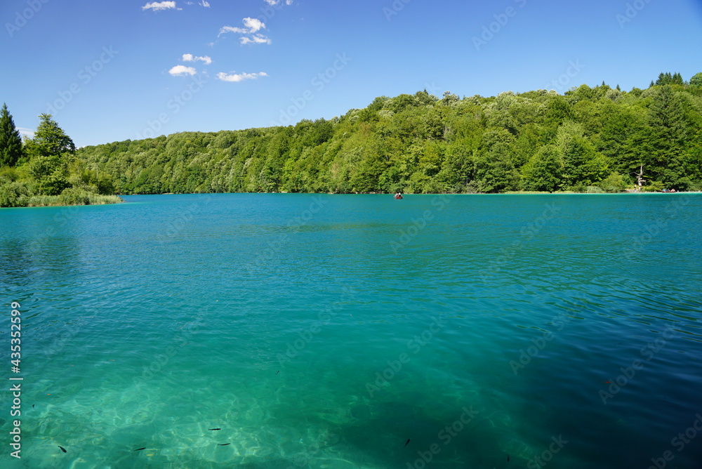 Sun glare in the emerald waters of one of the Plitvice Lakes Croatia Sun glare in the emerald waters of one of the Plitvice Lakes Croatia