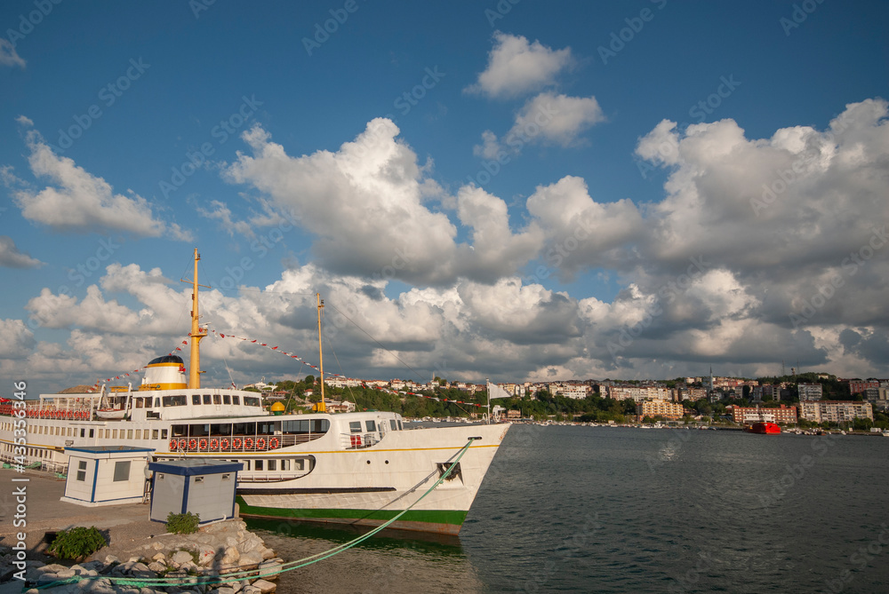 Naklejka premium Passenger ferry waiting in the port. Passenger ferry waiting at the marina. Şile Harbor istanbul Turkey.