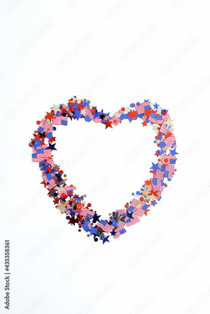 4th of July USA Independence Day confetti heart decorations american flag colors top view isolated. Copy space. Celebration memorial day in America.
