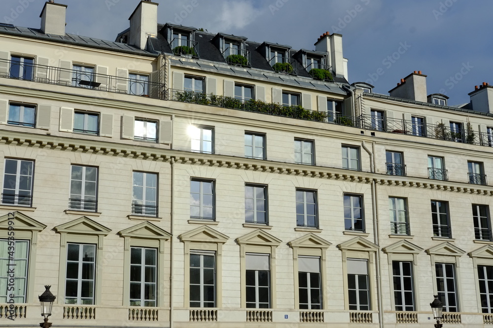The facade of some Parisian building. May 2021, France. The facade of some Parisian building. May 2021, France.