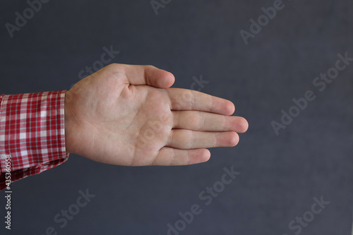 

an open male palm indicates the direction of movement