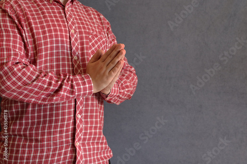 the man folded his hands in a prayer om