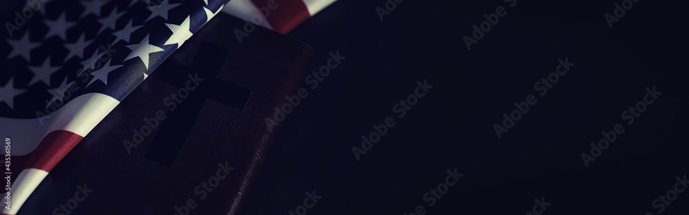 American flag and holy bible book on a mirror background. Symbol of the ...