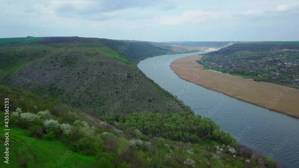 Flight over the river and small village in spring. Moldova republic of. Molovata village. River Dniester. Flight over the river and small village in spring. Moldova republic of. Molovata village. River Dniester.