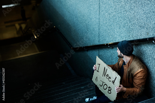 Homeless Man Asking For Job Sitting on Stairway Sidewalk
