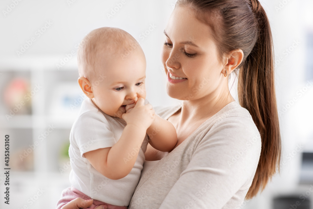 family, motherhood and people concept - happy mother with little baby daughter at home family, motherhood and people concept - happy mother with little baby daughter at home