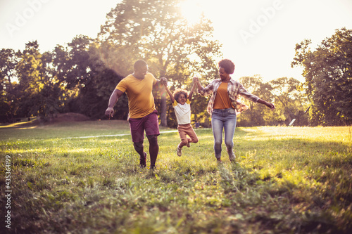  African American family having fun outdoors.