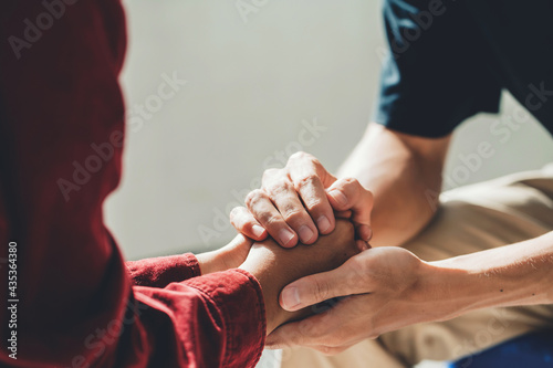 Man holding a woman's hand for warm, as psychological counseling concept of support, understanding care in love, Concept about encouraging and fighting problems.