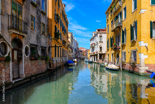 Narrow canal in Venice, Italy. Architecture and landmark of Venice. Cozy cityscape of Venice.