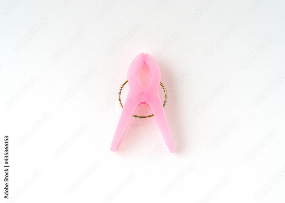 Pink clothespin isolated on white background. Pink clothespin isolated on white background.