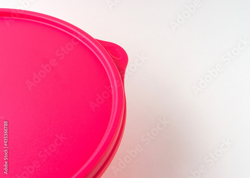 Red of plastic container isolated on white background.