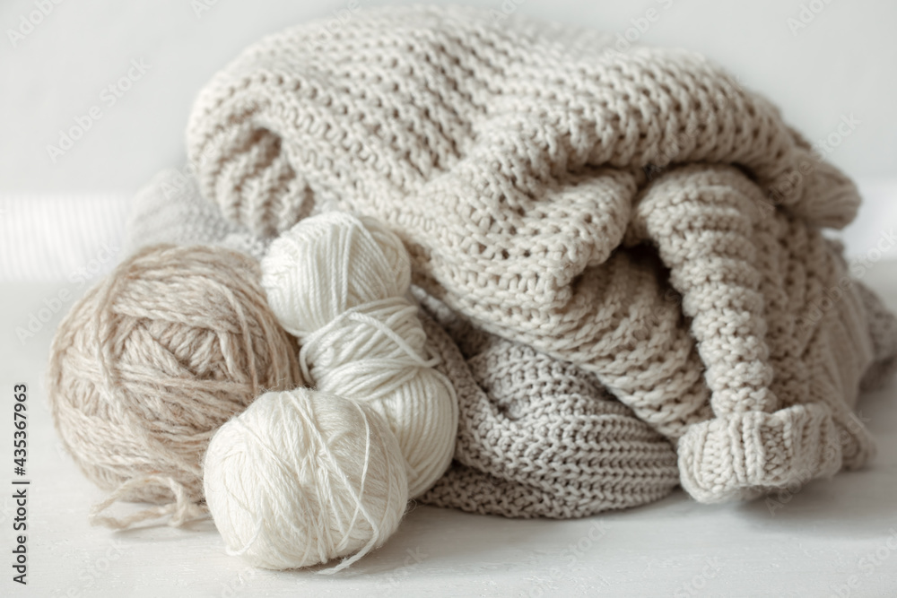 Cozy composition with knitted yarn in pastel colors. Cozy composition with knitted yarn in pastel colors.