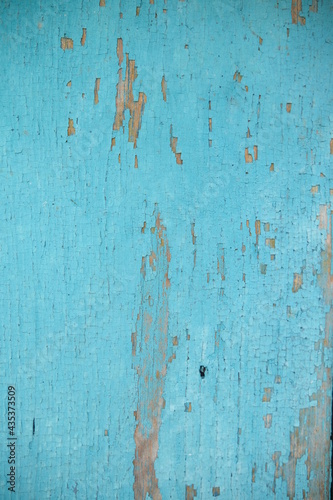 wooden texture. the old paint is scuffed. Turquoise color. Board. Painted timber.