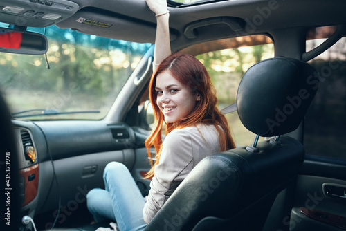 woman with an open window in the front seat of a car gesturing with her hands interior salon fellow traveler © SHOTPRIME STUDIO