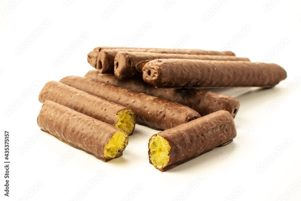 Bars of corn sticks in chocolate on a white background in a close-up with shadows isolated Bars of corn sticks in chocolate on a white background in a close-up with shadows isolated