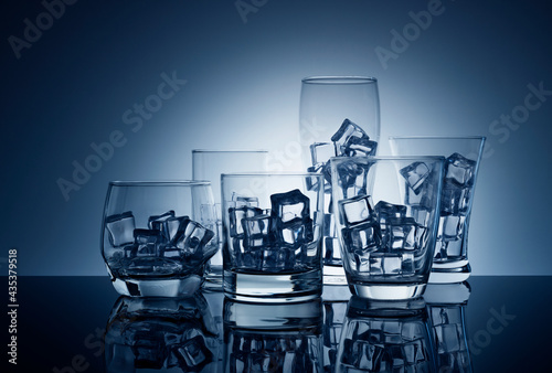 Ice in glass, Empty ice glasses without water,world water day,save water,blue background © chathuporn