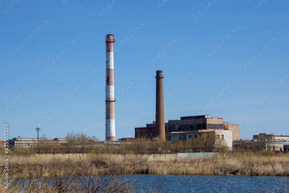 Industrial landscape with a factory. Industrial buildings are inscribed in nature and constitute an industrial landscape