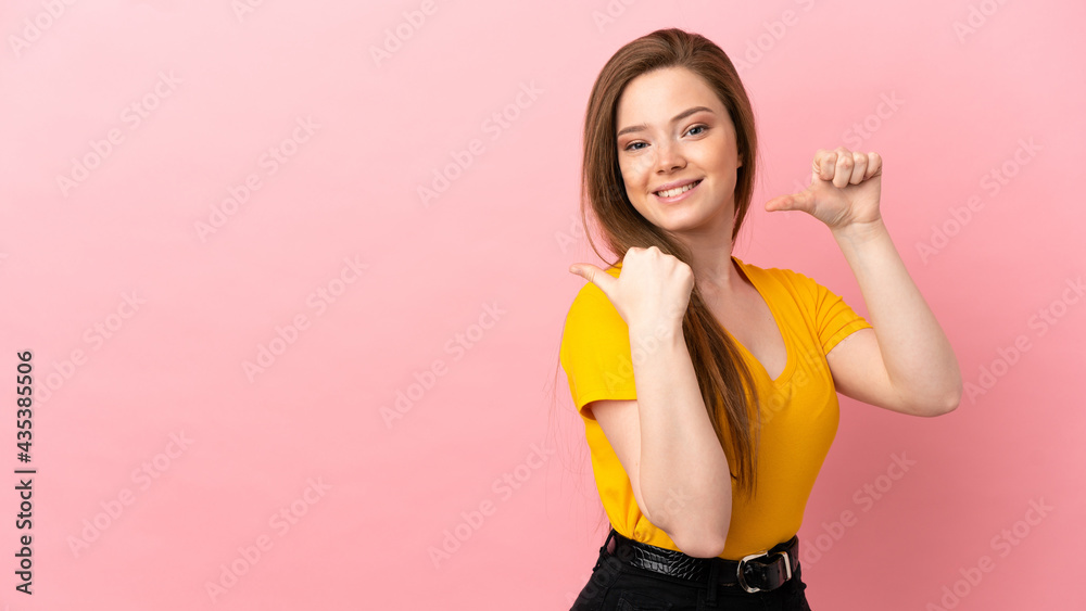 Teenager girl over isolated pink background pointing to the side to present a product Teenager girl over isolated pink background pointing to the side to present a product