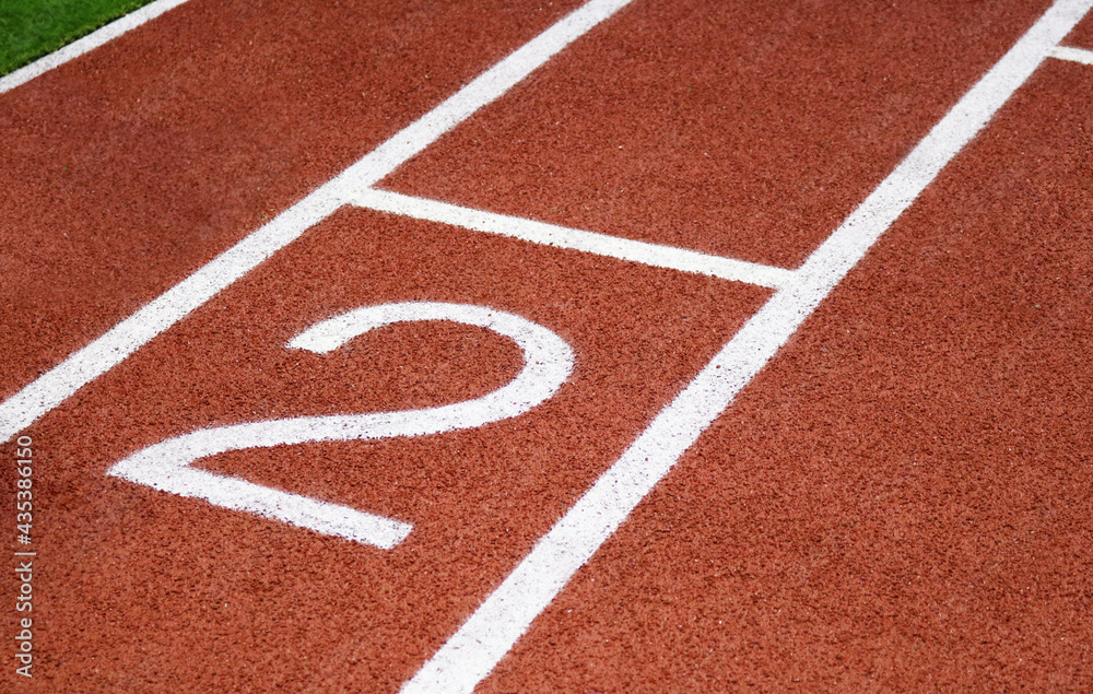 Red running track synthetic rubber surface background. Red running track synthetic rubber surface background.