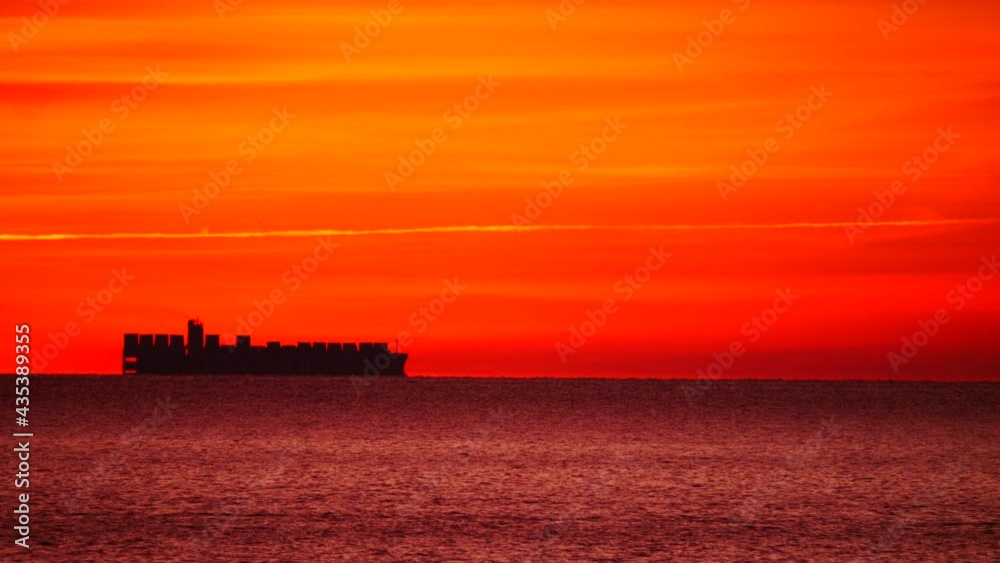 Seascape at morning with cargo container industrial ship on horizon. Logistic shipping concept. Seascape at morning with cargo container industrial ship on horizon. Logistic shipping concept.