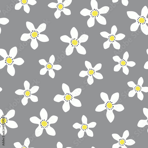 Vector seamless pattern with white and yellow lemon flowers on gray background. Summer illustration for swimwear  shorts and other fabrics in modern simple style.