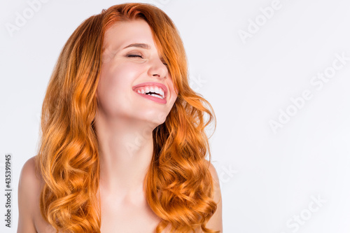 Photo portrait of girl with curly red hair laughing overjoyed dreamy smiling isolated white color background with empty copyspace