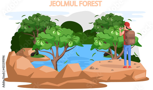 Traveling to asia to Jeju island by landmark jeolmul forest. Landscape park with tall trees famous showplace of green island in south korea, touristic entertainment, male traveler taking pictures
