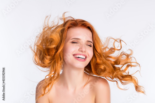 Photo portrait of young woman curly red hair smooth skin laughing flying hair naked shoulders isolated white color background