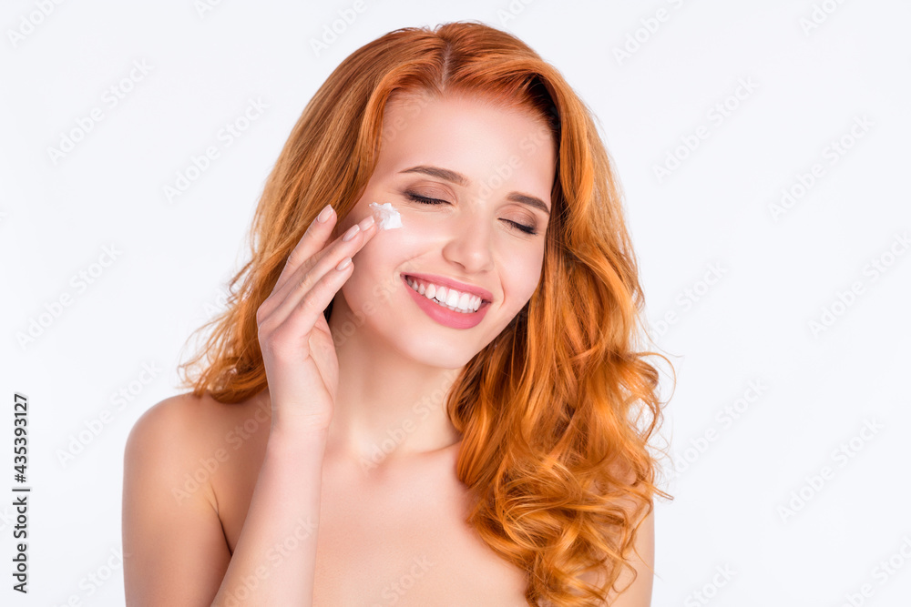 Photo portrait of woman curly red hair soft skin applying nourishing cream dreamy enjoy isolated white color background Photo portrait of woman curly red hair soft skin applying nourishing cream dreamy enjoy isolated white color background